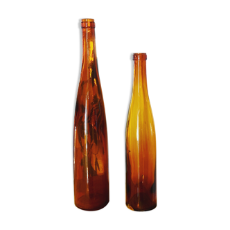 Set of two vintage orange glass bottles