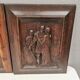 Four old wooden carvings to hang on the wall.