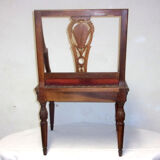 A Chair from the beginning of the 20th century in natural wood.