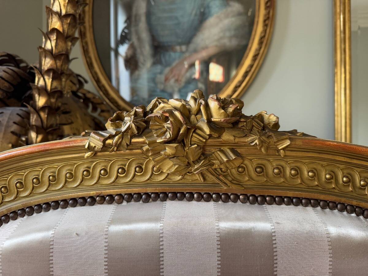 Pair of late 19th-century gilded wooden beds in Louis XVI style.