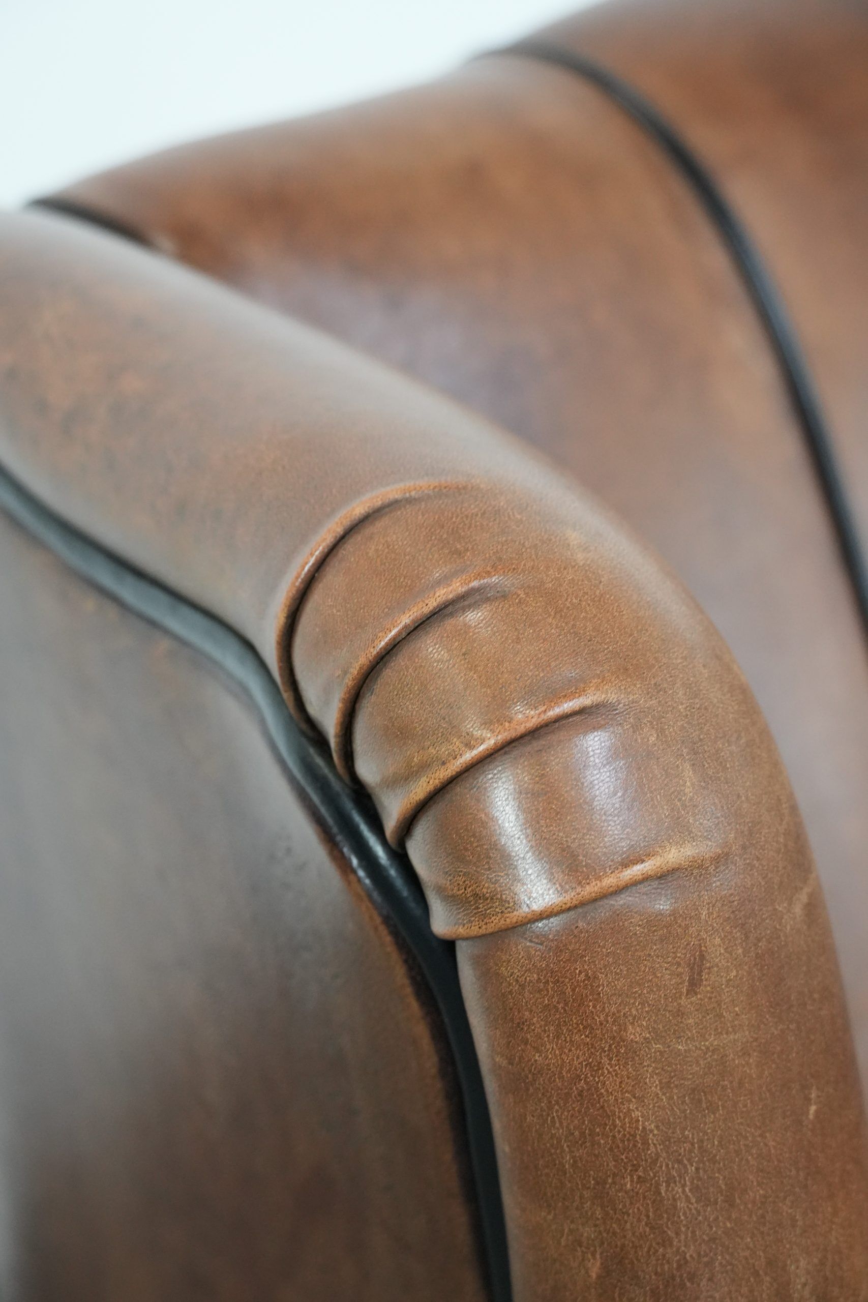 Sheepskin wingback armchair with beautiful colours in good condition