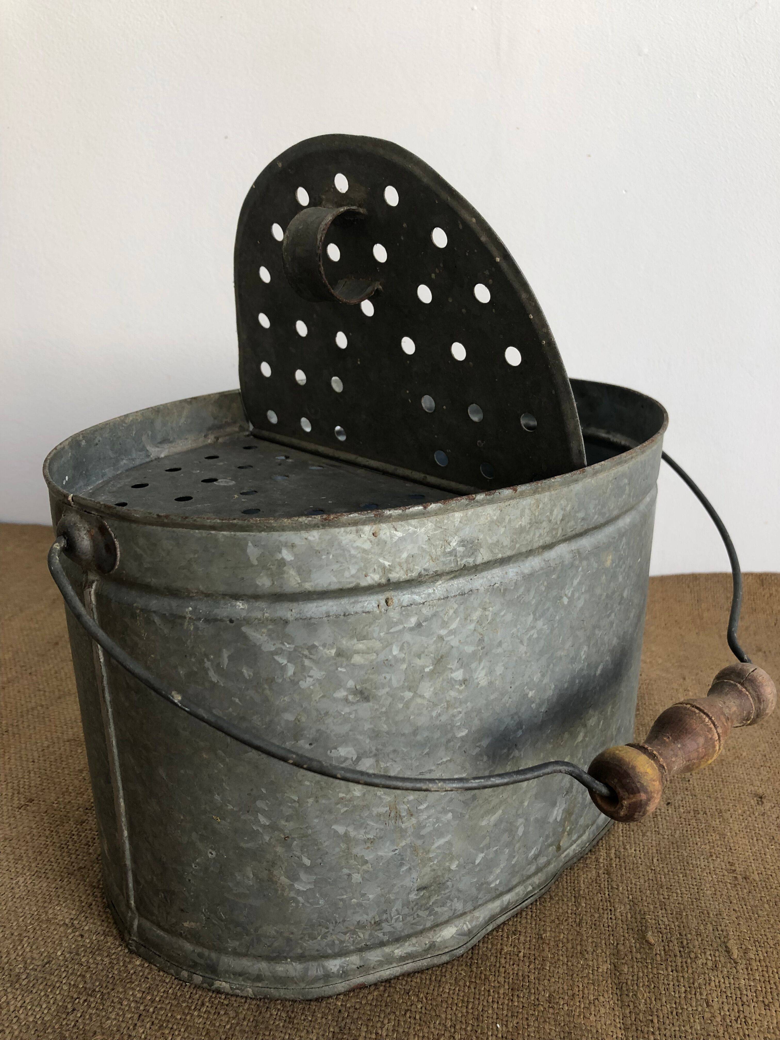 Old zinc stud, fisherman's live bucket