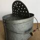 Old zinc stud, fisherman's live bucket