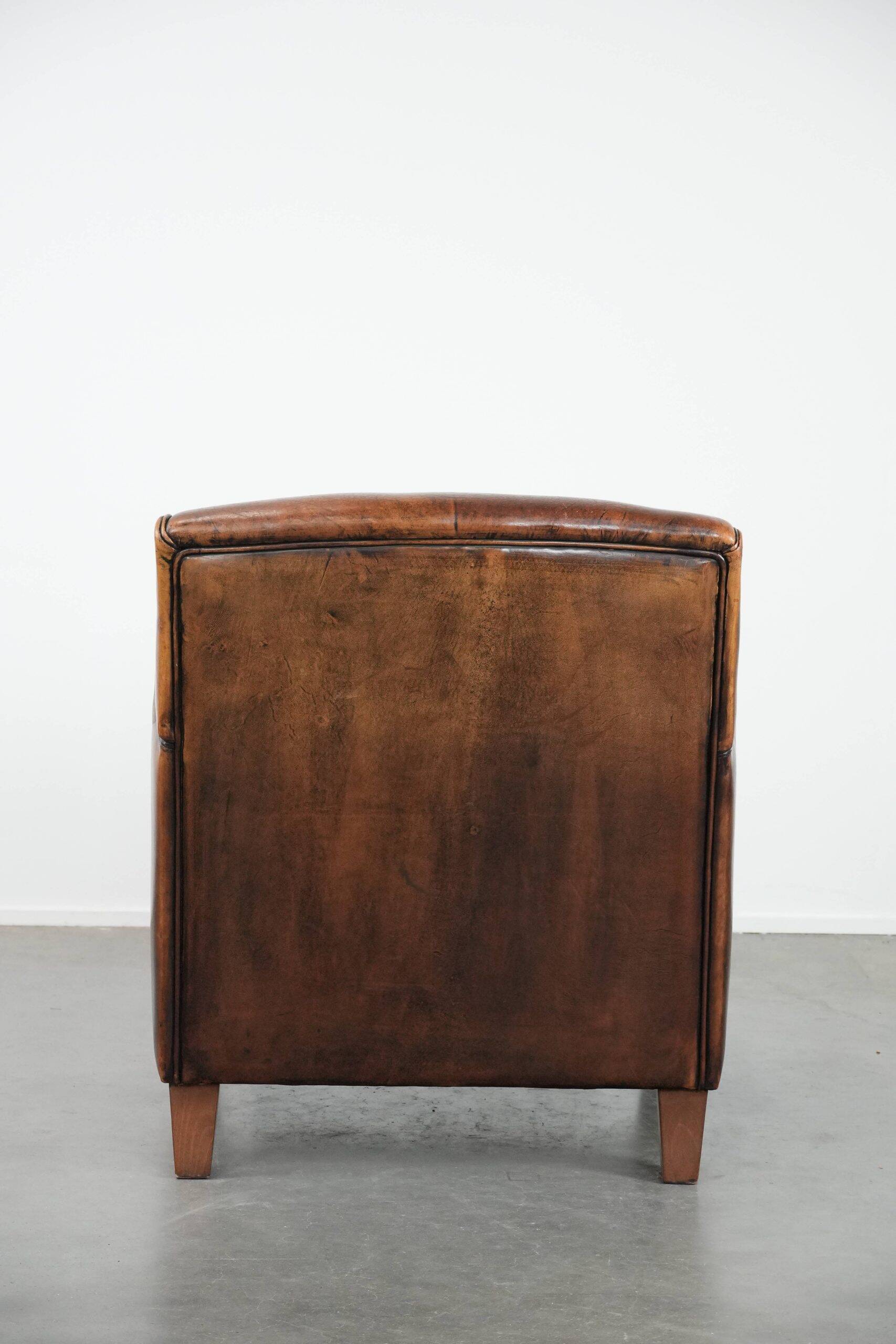 Characterful vintage sheepskin leather armchair with beautiful colours