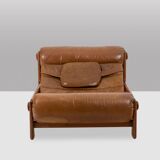 Lounge chair and ottoman, in blond elm and leather. 1970s