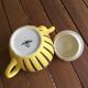 Teapot in yellow and black porcelain stamped Sarreguemines