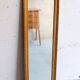 Long miroir en bois et stuc doré vintage