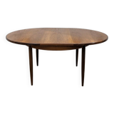 Round and extendable dining table published by G-Plan