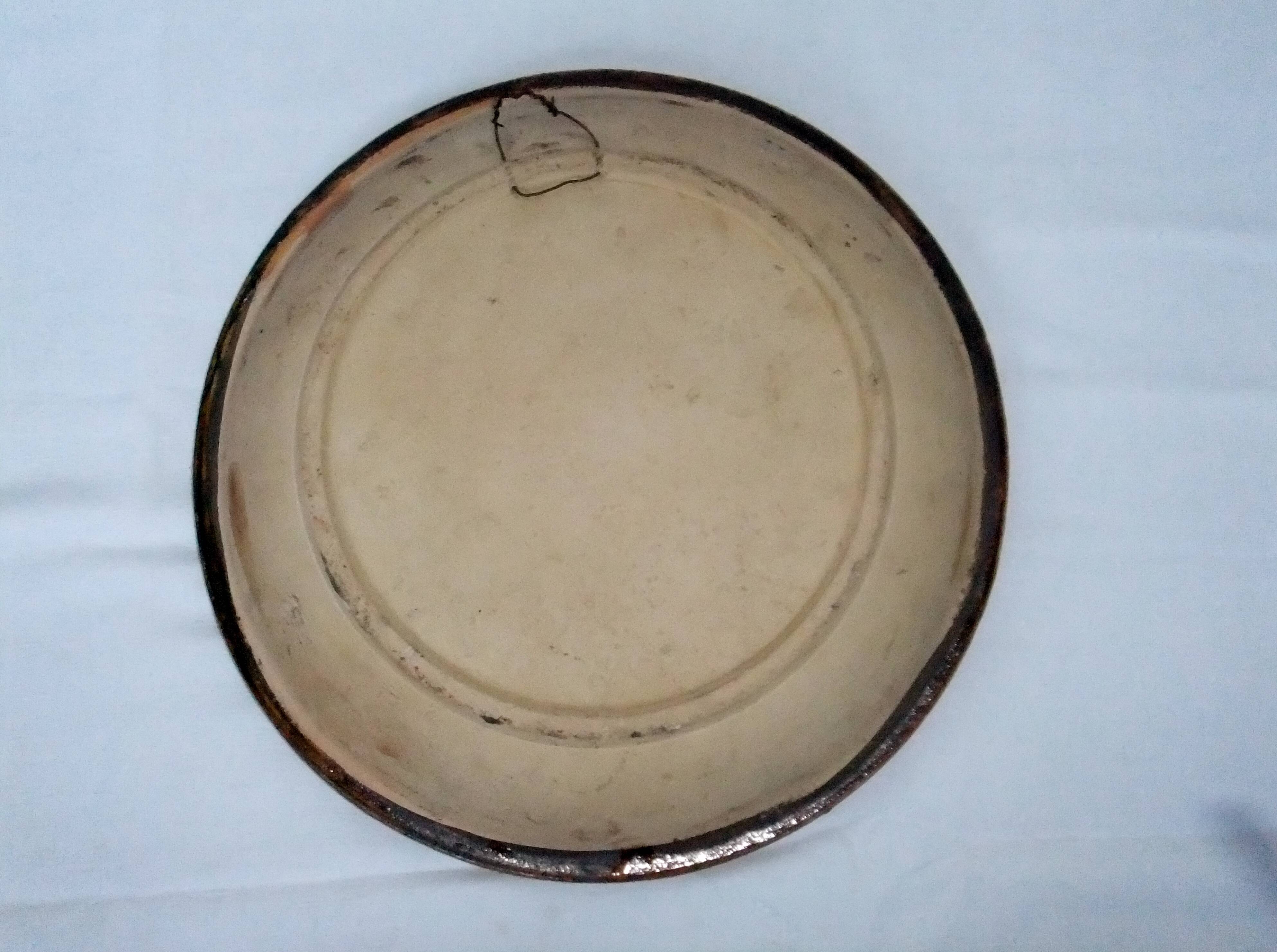 old terracotta dish decorated with rooster