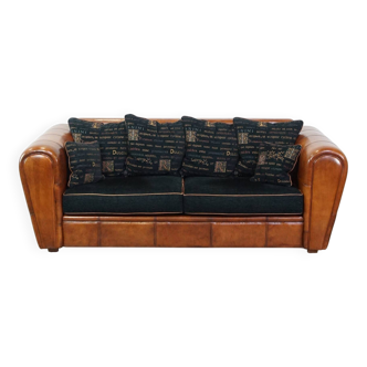 Canapé 2,5 places en cuir d'agneau et coussins en tissu