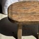 Small stool, oval solid teak side table with curved legs in wabi-sabi style.