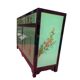 Lacquered buffet in soft green with floral patterns.