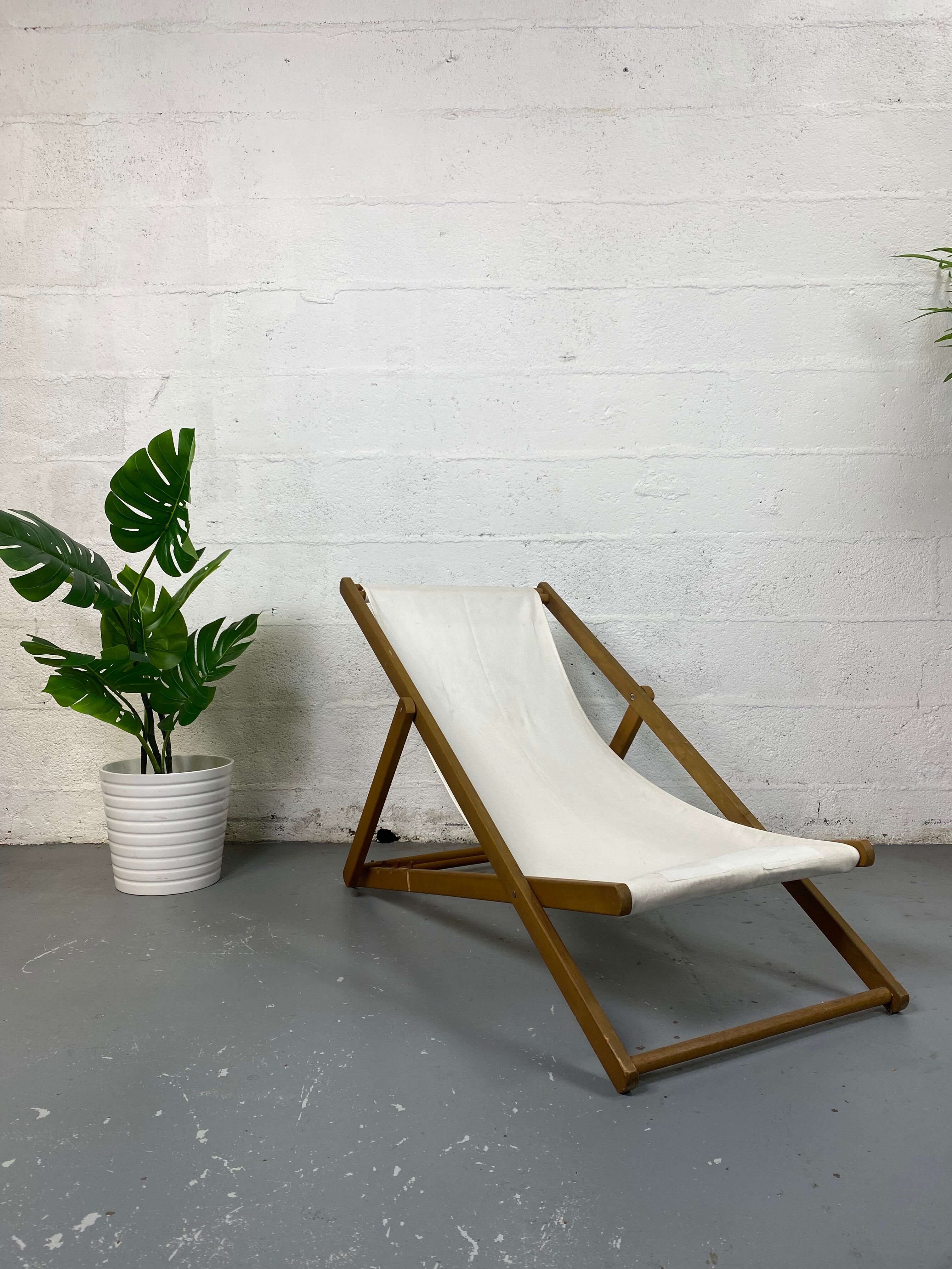 White fabric deckchair with wooden structure