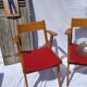 Pair of wooden armchairs and skaï foot compass of the 50s