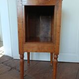 Open wooden bedside table