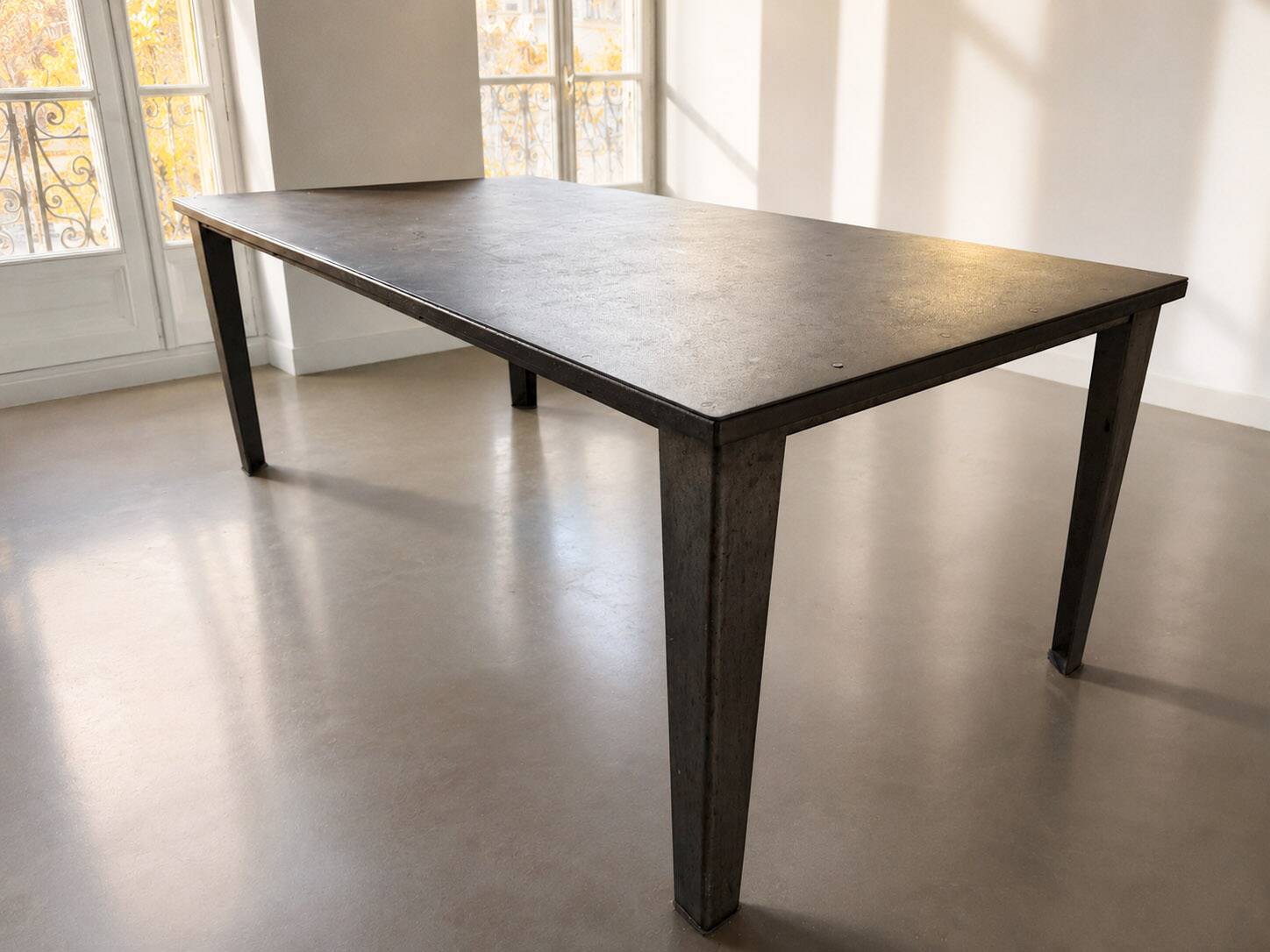 Industrial table made from old bumper car flooring.