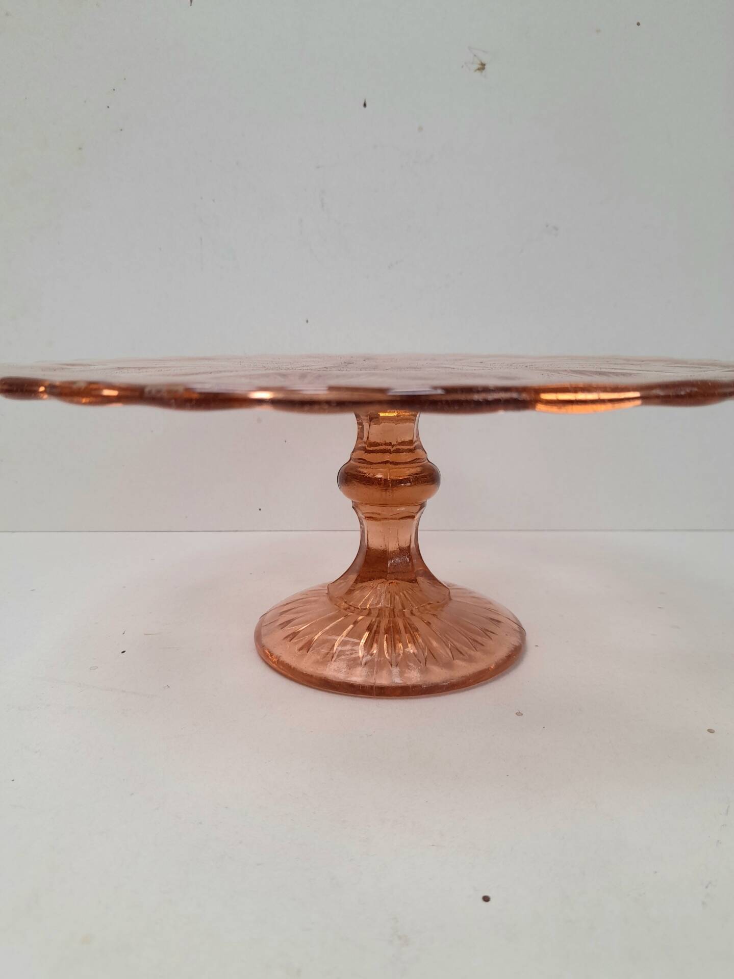 Pink pressed glass cake stand