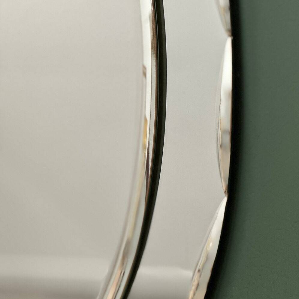 1970s Italian oval mirror by Crystal Arte with faceted glass frame
