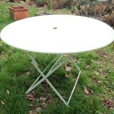 Old round folding metal table