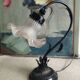 Tulip lamp in patinated black metal with an opaque glass shade.