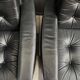 2 Black leather arm chairs 1960s on wheels