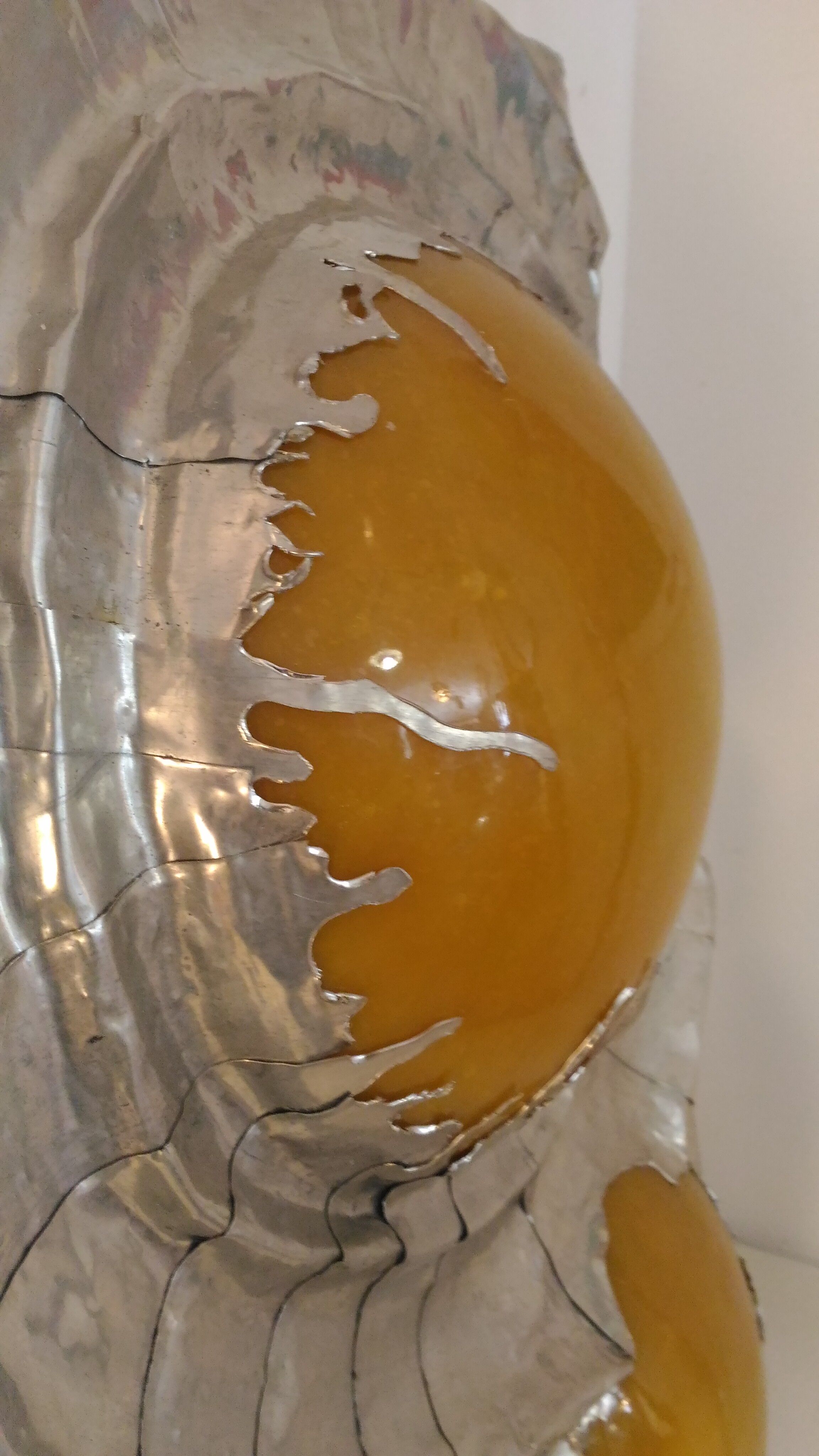 Bright sculptural wall sconce