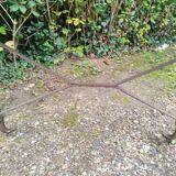 Antique bistro table with iron legs and wooden top