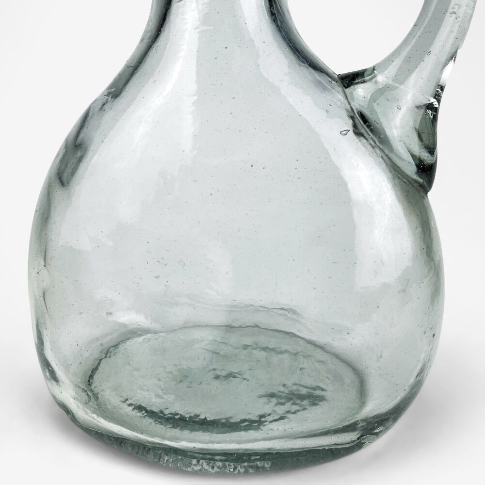 Antique water jug made of thick blown glass