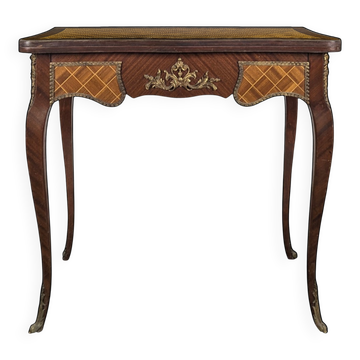 Louis XV style game table with marquetry and gilded bronze.