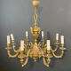 Important bronze chiseled chandelier in Louis XVI style with 8 light arms by Lucien Gau.