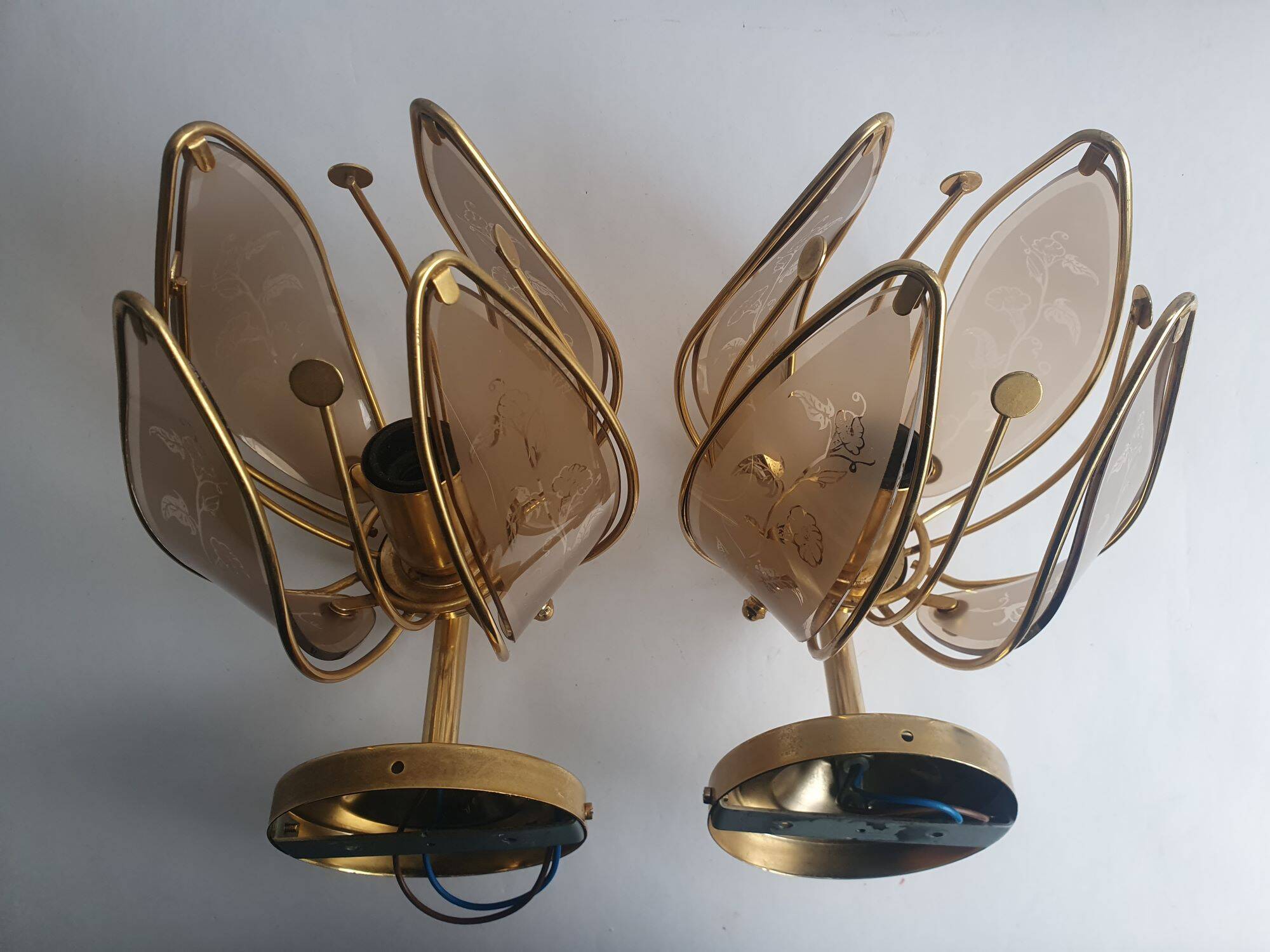 Pair of vintage brass wall sconces with glass shades