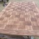 Louis XV style walnut table with a natural wood top.