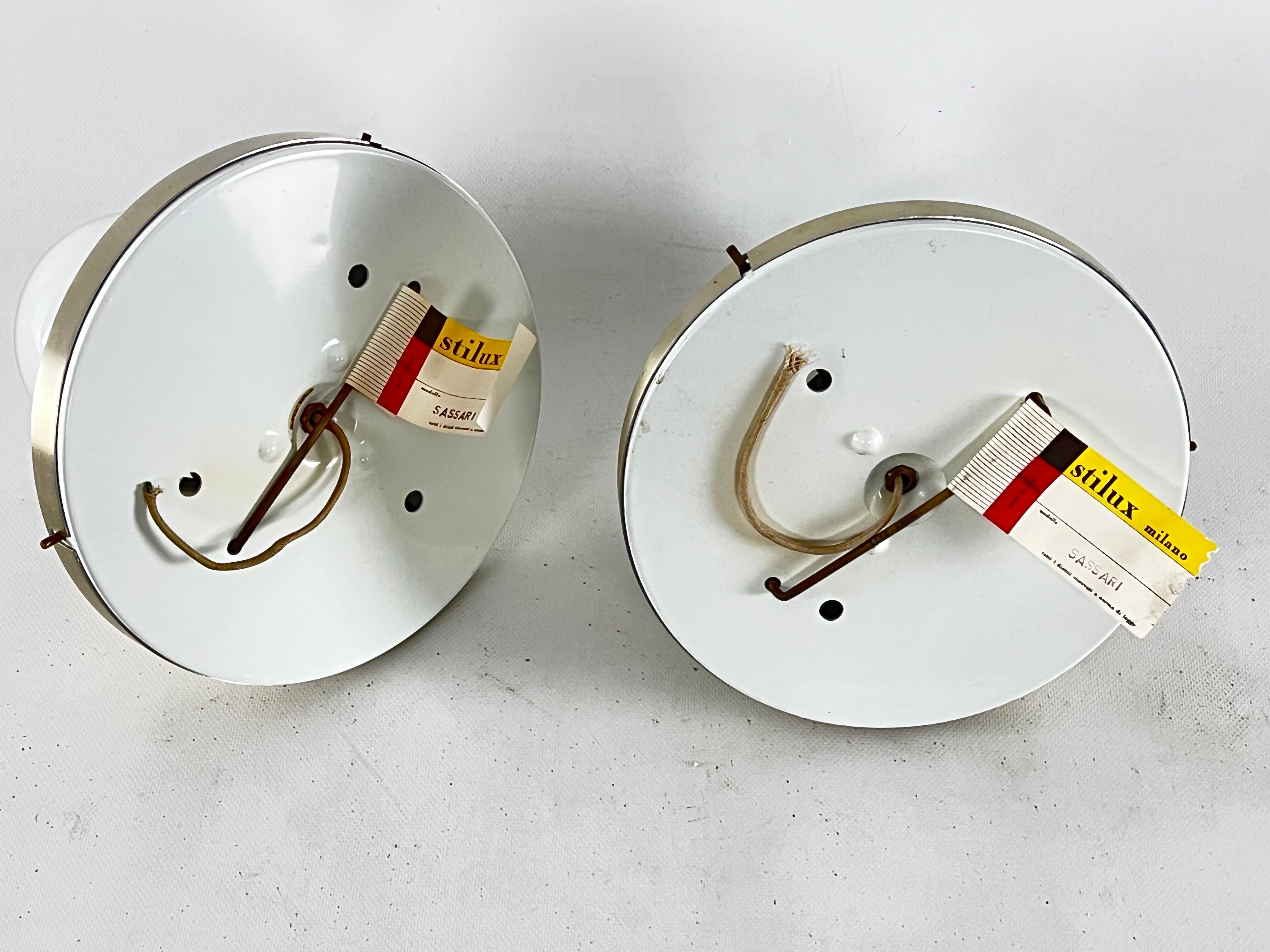Stilux Milano, vintage round gilded aluminum wall lamps from 60s. Set of two
