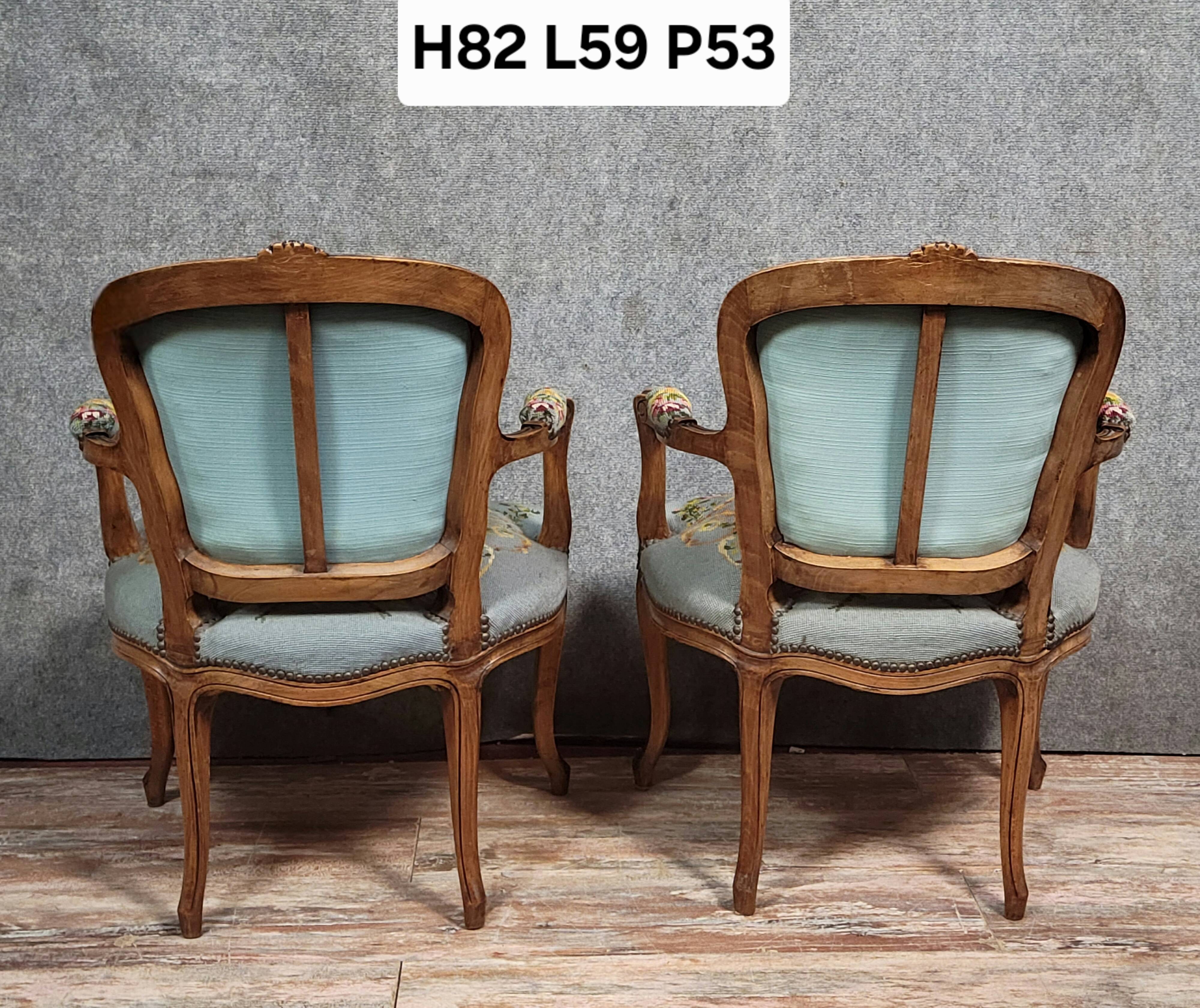 Pair of Louis XV style cabriolet armchairs in walnut