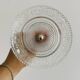 Bowl on a foot in worked glass and elegant metal
