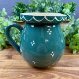 Green glazed ceramic jug