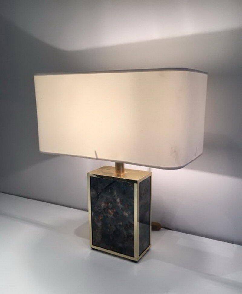 Lamp in gilded metal and stylized glass. In the style of Aldo Tura