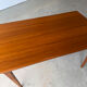 Rectangular extendable table with a Scandinavian design in solid teak.