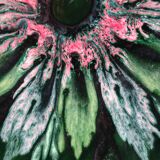 Green faience bowl decorated with multicolored drips around 1970