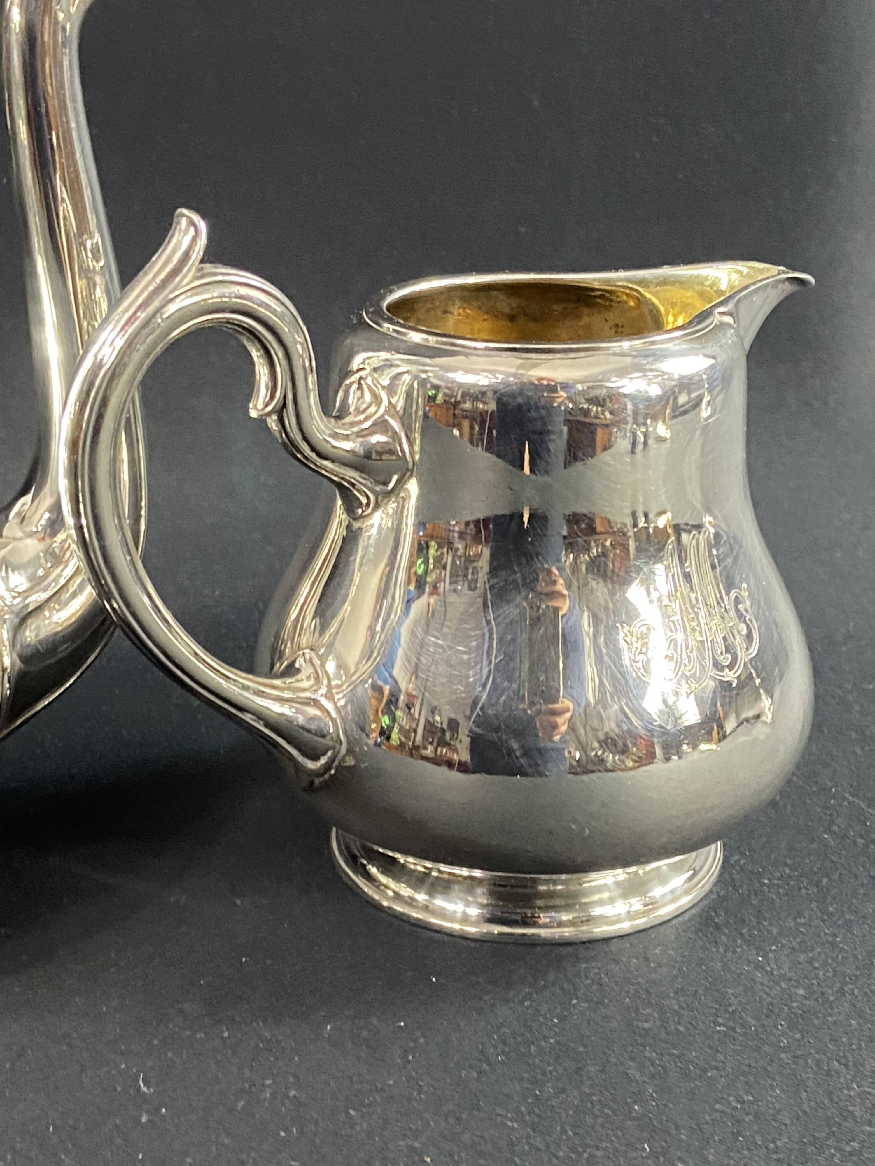 Silver-plated coffee pot and milk jug monogrammed MA, signed CHRISTOFLE.