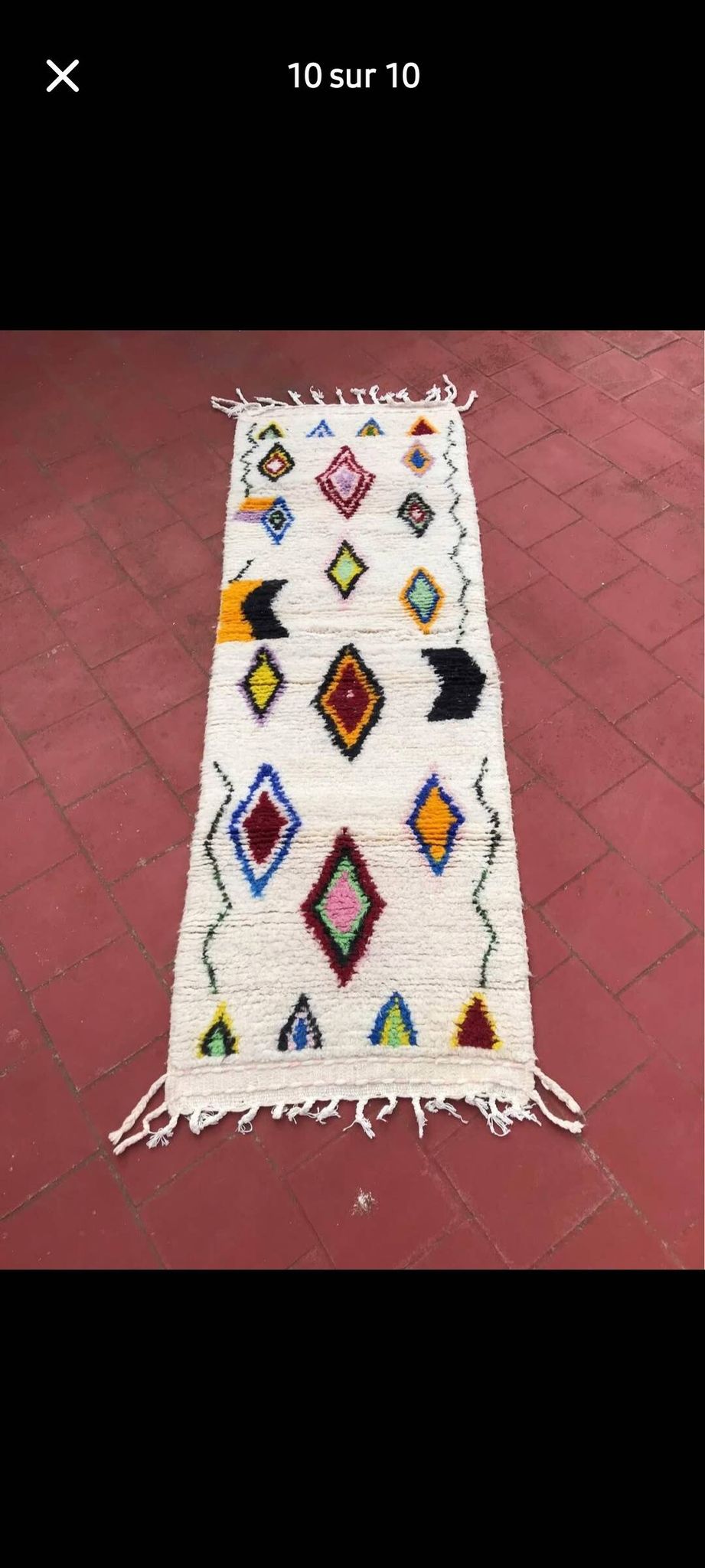 Colourful Moroccan rug made of natural wool. Woven by artisans.
