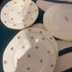 Dessert plate and porcelain dishes with a multicoloured floral pattern, vintage.