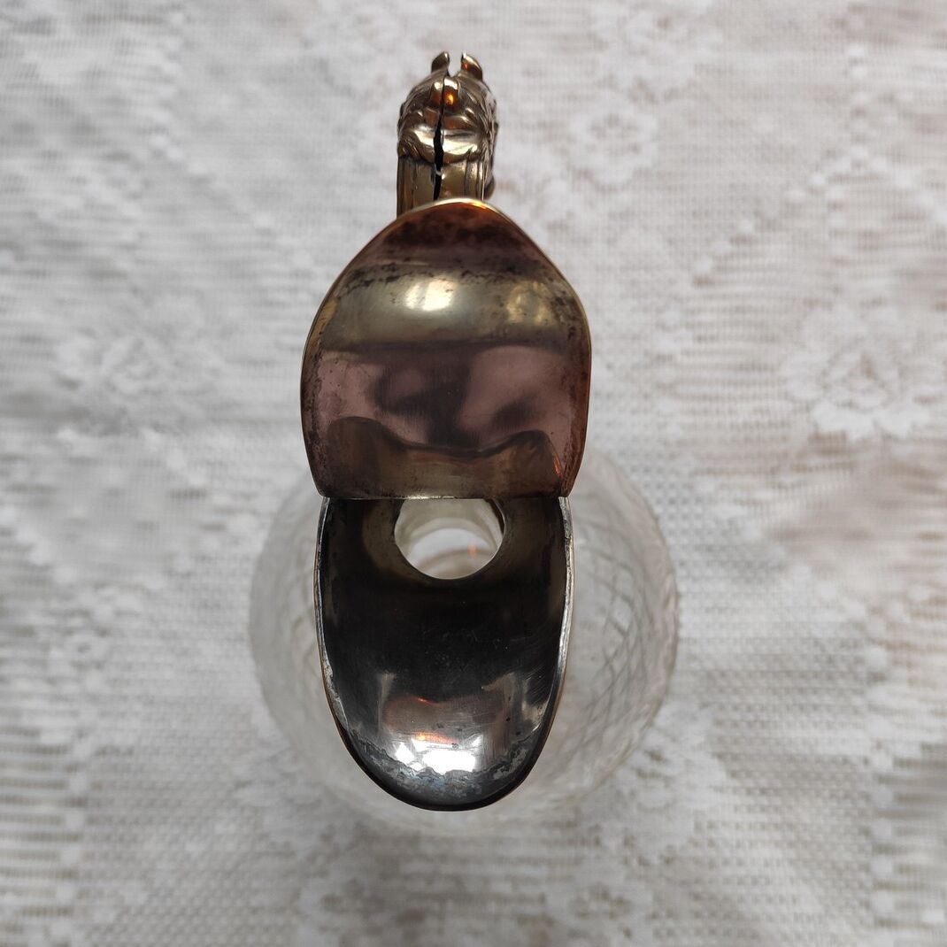 Cut crystal ewer and brass