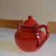 Vintage tea in red and black enamelled sheet