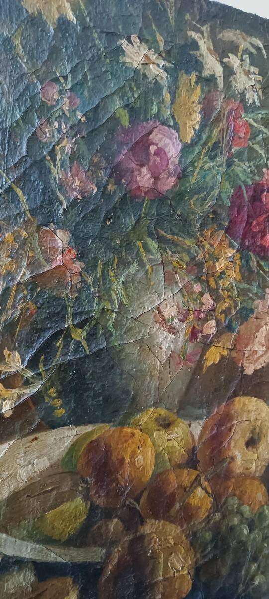 19th-century oil painting on canvas depicting a vase of fruit with flowers.