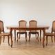Louis XV table and 4 chairs in wood and marquetry.