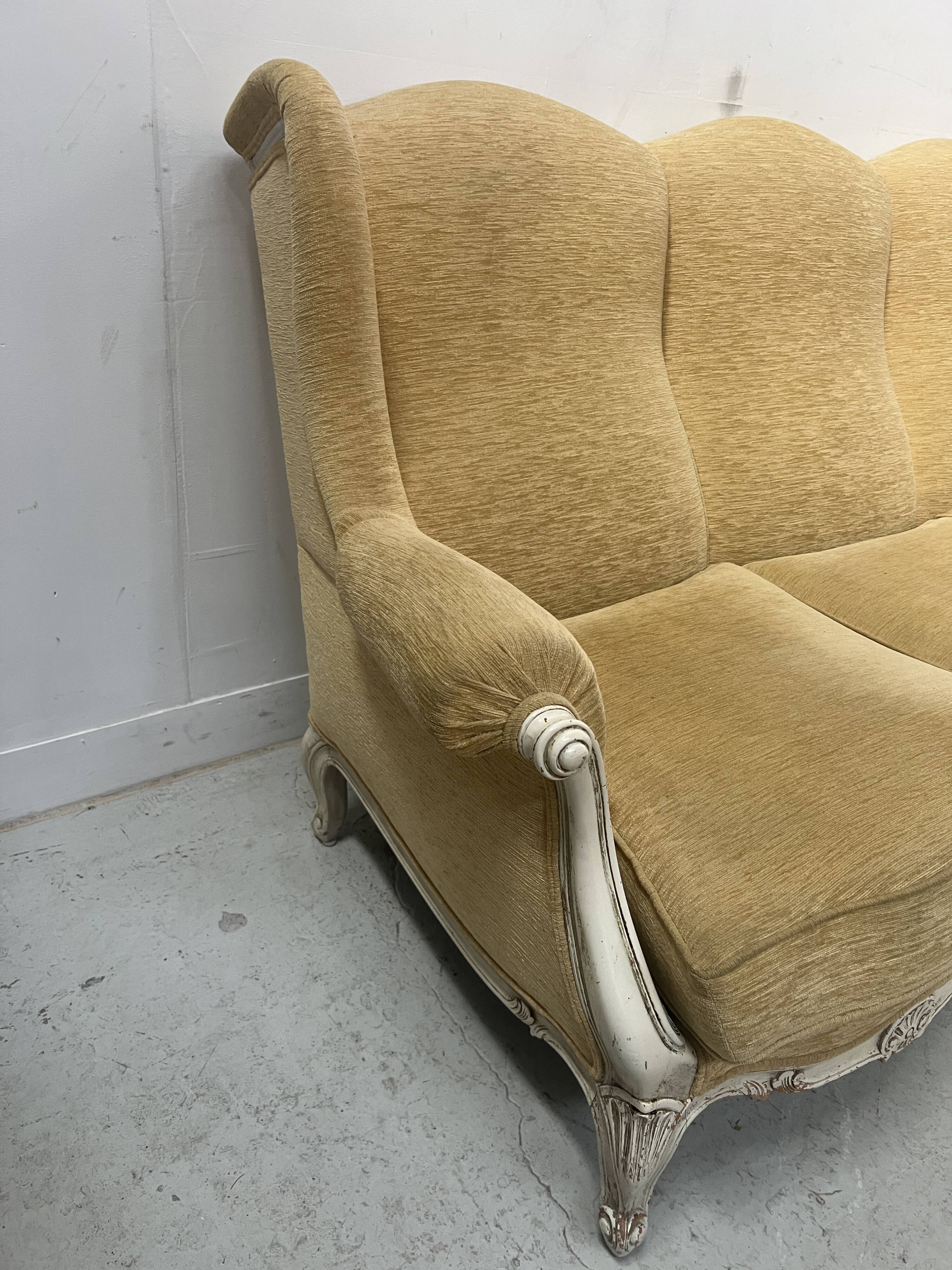 Louis XV style three-seater wingback sofa in patinated beech, 20th century