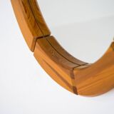 Sculptural wall-mirror in solid pine