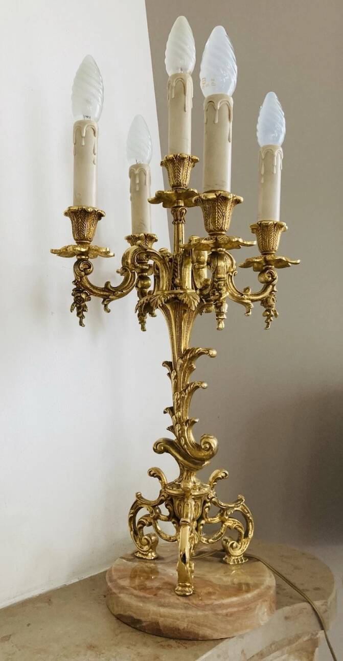 Pair of gilt bronze chandeliers, marble bases.