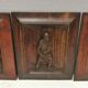 Four old wooden carvings to hang on the wall.